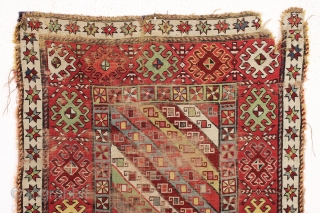 antique caucasian long rug, probably talish. Nice design with good colors featuring rich greens, multiple reds, light blues, and a deep purple. "as found", with wear, heavy black oxidation and some damage  ...