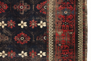 antique baluch rug with mina-hani design field. Characteristic older asymmetric flowers. All good natural colors with a nice ember red. Floppy handle with some scattered wear and heavy brown oxidation. Good age,  ...