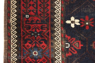 antique baluch rug with mina-hani design field. Characteristic older asymmetric flowers. All good natural colors with a nice ember red. Floppy handle with some scattered wear and heavy brown oxidation. Good age,  ...