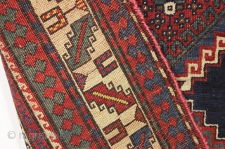 antique kazak or gendge rug with interesting inscriptions. Good thick medium length pile. All natural colors. "As found", very very dirty and with old moth nibbles (dinners) in the deep blue ground.  ...