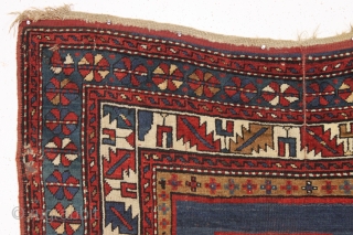 antique kazak rug with an eye catching empty field. Mostly good pile. As found, a bit dirty with scattered slight wear, few very small holes and creases as shown. Original selvages and  ...