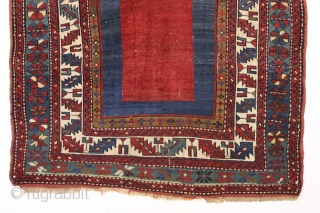 antique kazak rug with an eye catching empty field. Mostly good pile. As found, a bit dirty with scattered slight wear, few very small holes and creases as shown. Original selvages and  ...