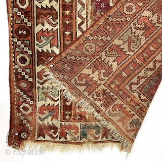 Antique little Turkish village prayer rug, possibly bergama, with some interesting design features and older colors but very rough condition. Appears both madder and cochineal reds used. Attractive ivory “leaf” border. Overall  ...