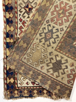 Early Kazak rug with a very unusual field design. The weaver created a novel eye dazzling “candy cane” lattice field and used traditional bold Kazak borders. All very good natural colors featuring  ...