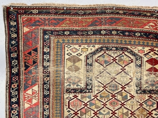 Early ivory ground shirvan prayer rug with unusual elements and extremely saturated natural colors. Some lattice elements are unusual if not unique. Unfortunately the rug is in very rough condition with areas  ...
