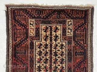 Antique camel ground Baluch prayer rug in rather good condition. Text book design other than unusually tiny hand panels and the “tree of life” trunk made up from tiny turkman motifs. Overall  ...