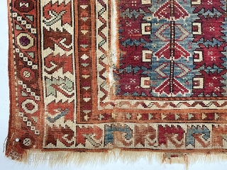 Antique little Turkish village prayer rug, possibly bergama, with some interesting design features and older colors but very rough condition. Appears both madder and cochineal reds used. Attractive ivory “leaf” border. Overall  ...