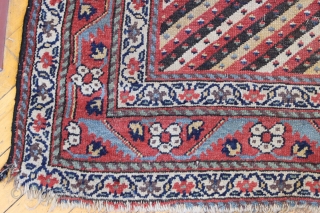 Antique northwest persian or kurdish long rug. Nice design. Fresh off a New England floor. All natural colors with great old purples. Condition as shown, a bit dirty with some wear as  ...