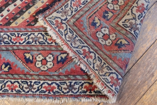 Antique northwest persian or kurdish long rug. Nice design. Fresh off a New England floor. All natural colors with great old purples. Condition as shown, a bit dirty with some wear as  ...