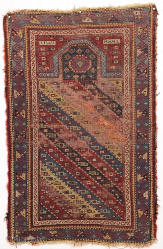 Antique early caucasian prayer rug, dated 1286. Interesting design with an unusual and well drawn border. "As found", very dirty with low pile, some wear and edge roughness as shown. Areas of  ...