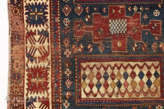 Early large kazak rug. Unusual and archaic kazak with karachopf family resemblance but on it's own branch of the family tree. I am transfixed by the mysterious ivory boxes filled with carnival  ...