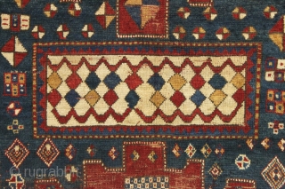 Early large kazak rug. Unusual and archaic kazak with karachopf family resemblance but on it's own branch of the family tree. I am transfixed by the mysterious ivory boxes filled with carnival  ...