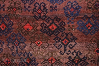 antique turkish knotted baluch rug in pretty good condition with a wild design and great color. All beautiful natural colors including small bits of fiery red highlights. "as found", with allover good  ...