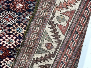 Antique tribal pile rug in good condition with some unusual design features. Possibly Veramin? Overall good medium length pile with very light wear. The dark blue field densely packed with latch hooked  ...