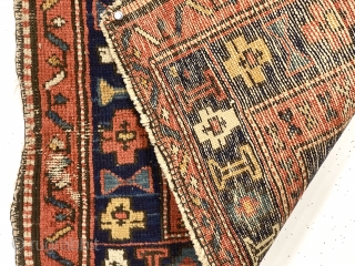 Antique little northwest Persian bagface, or more likely a mat, with attractive design and good natural colors. Overall low pile with a spot or two of wear exposing foundation. Appears to have  ...