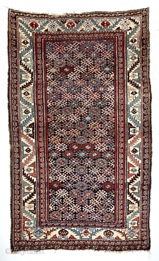 Antique tribal pile rug in good condition with some unusual design features. Possibly Veramin? Overall good medium length pile with very light wear. The dark blue field densely packed with latch hooked  ...