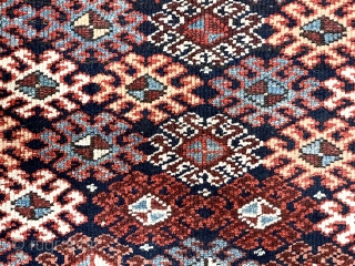 Antique tribal pile rug in good condition with some unusual design features. Possibly Veramin? Overall good medium length pile with very light wear. The dark blue field densely packed with latch hooked  ...