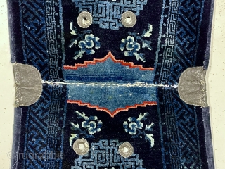 Beautiful antique Chinese saddle rug. Attractive rich indigo blue color and vibrant highlights. Overall mostly good thick lustrous pile. Old cloth backing, probably original. Reasonably clean. Late 19th c.  2’3”x 4’7” 