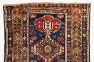 antique caucasian shirvan rug in fair condition for an older example. A karagashli variant with all natural colors featuring a pretty gold colored main border. Even low cut pile with scattered wear  ...