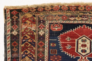 antique caucasian shirvan rug in fair condition for an older example. A karagashli variant with all natural colors featuring a pretty gold colored main border. Even low cut pile with scattered wear  ...