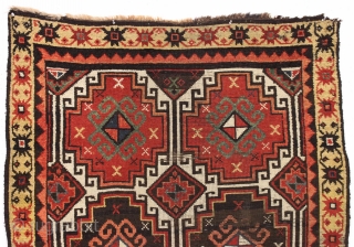 Antique caucasian ivory ground long rug. Complete and original with an unusual border arrangement showing no outer minor border. Original dark wool or goat hair selvages. Nearly black wefting indicating possible Zakataka  ...