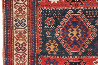 antique kazak rug with an interesting compartment design. All natural colors featuring a good saturated tomato red and nice deep greens. Mostly good pile with some wear and brown oxidation as shown.  ...