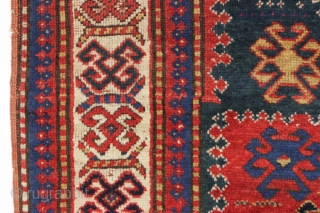 antique kazak rug with an interesting compartment design. All natural colors featuring a good saturated tomato red and nice deep greens. Mostly good pile with some wear and brown oxidation as shown.  ...