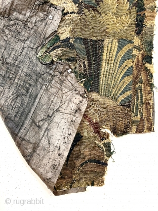 Small authentic verdure tapestry fragment, in very rough condition, likely 18th c. or earlier. As found, small holes, tears and rough edges all around. Reasonably clean. Sewn to old backing. 33” x  ...