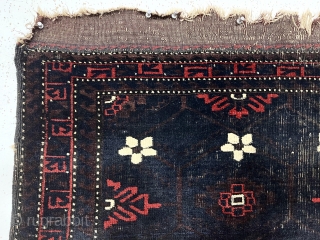 Antique Baluch weaving, either an unusually large bagface or an uncommon small mat. Spacious early drawing of classic Mina Hani design with a barely visible brown lattice on the deep blue ground.  ...