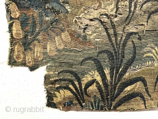 Small authentic verdure tapestry fragment, in very rough condition, likely 18th c. or earlier. As found, small holes, tears and rough edges all around. Reasonably clean. Sewn to old backing. 33” x  ...