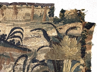 Small authentic verdure tapestry fragment, in very rough condition, likely 18th c. or earlier. As found, small holes, tears and rough edges all around. Reasonably clean. Sewn to old backing. 33” x  ...