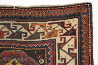 Antique caucasian rug. Unusual field and an interesting rendition of this border type. All natural colors. An unusual palette including a deep natural orange, a strong clear yellow, a dark aubergine and  ...