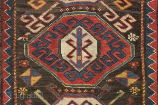 Antique caucasian rug. Unusual field and an interesting rendition of this border type. All natural colors. An unusual palette including a deep natural orange, a strong clear yellow, a dark aubergine and  ...