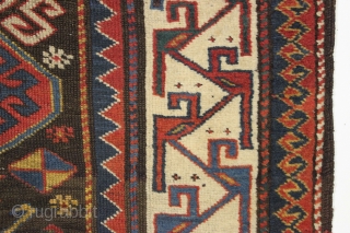 Antique caucasian rug. Unusual field and an interesting rendition of this border type. All natural colors. An unusual palette including a deep natural orange, a strong clear yellow, a dark aubergine and  ...