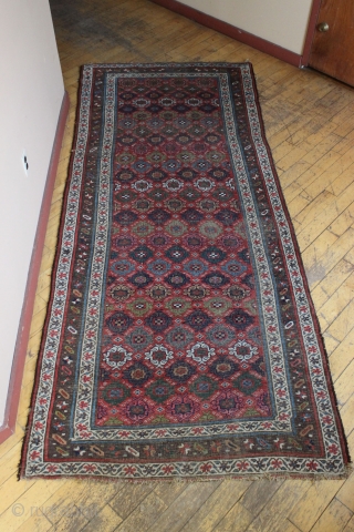 antique kurd bidjar long rug. Interesting and unusual field design. All natural colors. Pile varies from decent medium to low with foundation peeking. No repairs. A charming floor rug, a bit rough  ...