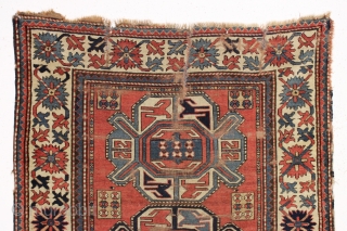 antique kazak rug with a wide "crab" border. All natural colors. As found, very dirty, with wear and some damage as shown but complete with original selvages. In need of at least  ...