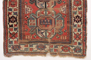 antique kazak rug with a wide "crab" border. All natural colors. As found, very dirty, with wear and some damage as shown but complete with original selvages. In need of at least  ...