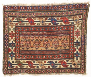 antique soumak bagface. Pretty gold ground. Unusual wide format. Good weave. All natural colors featuring nice old greens and light blues. Clean. I see a small fairly well done repair in center.  ...