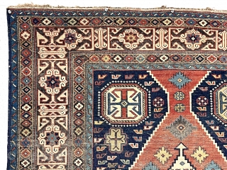 Antique Caucasian shirvan rug with a somewhat uncommon field paired with a nicely drawn Kufic border. Overall even very low pile with scattered wear and oxidation. All natural colors including nice yellow  ...