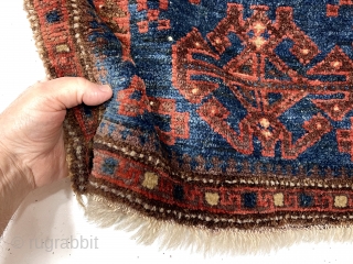 Antique unusual little blue ground Baluch bagface. A field design I have not encountered before along with an equally unusual border of hooked boxes.  Uncommon size more like a turkman mafrash.  ...