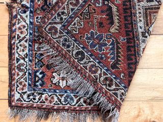 Antique little northwest Persian bagface or mat (likely). Attractive ivory medallion surrounded by scattered herati elements. Some edge unraveling and a small gouge. Good natural colors. Even low pile. Depressed weave. Could  ...