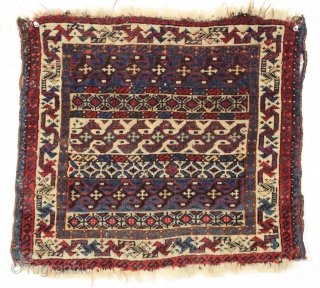 Antique top quality little Persian bagface. Rare design. Fine weave with lustrous wool. Beautiful all natural colors. Edge roughness. ca. 1875. 19" x 22"         