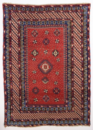 Antique large kazak with tiny stars, or are they snowfakes? The spacious field framed with an unusual eye catching striped border and a matching pair of terrific trefoill minors. All beautiful natural  ...