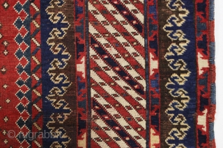 Antique large kazak with tiny stars, or are they snowfakes? The spacious field framed with an unusual eye catching striped border and a matching pair of terrific trefoill minors. All beautiful natural  ...