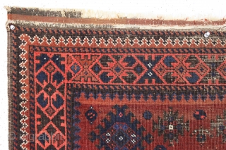 antique little baluch rug. Older example of this interesting type. Thin with wear and heavily oxidized browns as shown. Difficult to photograph but guaranteed all good natural colors. Could use a good  ...