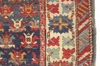 Old caucasian rug, possibly kazak, with unusually good colors but in distressed condition. The large range of natural colors contains lovely greens and blues and a very fine old apricot orange. Very  ...