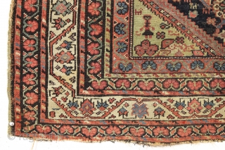 Antique ferrahan rug with interesting design elements but unfortunately damaged by a cannonball. All good colors featuring that nice characteristic apple green. Many little animals and charming humans. Selling "as found", very  ...