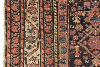 Antique ferrahan rug with interesting design elements but unfortunately damaged by a cannonball. All good colors featuring that nice characteristic apple green. Many little animals and charming humans. Selling "as found", very  ...