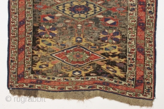 Antique caucasian kuba soumak long rug. Great yellows and greens. Original sides and end finish. The heavily oxidized brown ground has areas poorly filled in and should be restored. The design elements  ...