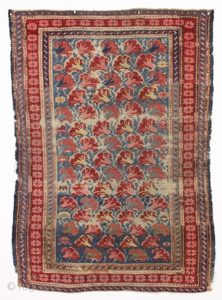 antique little kuba seichour rug with an iconic floral array on a beautiful light blue ground. "as found", overall fair pile with almost entirely oxidized browns. All natural colors including an attractive  ...